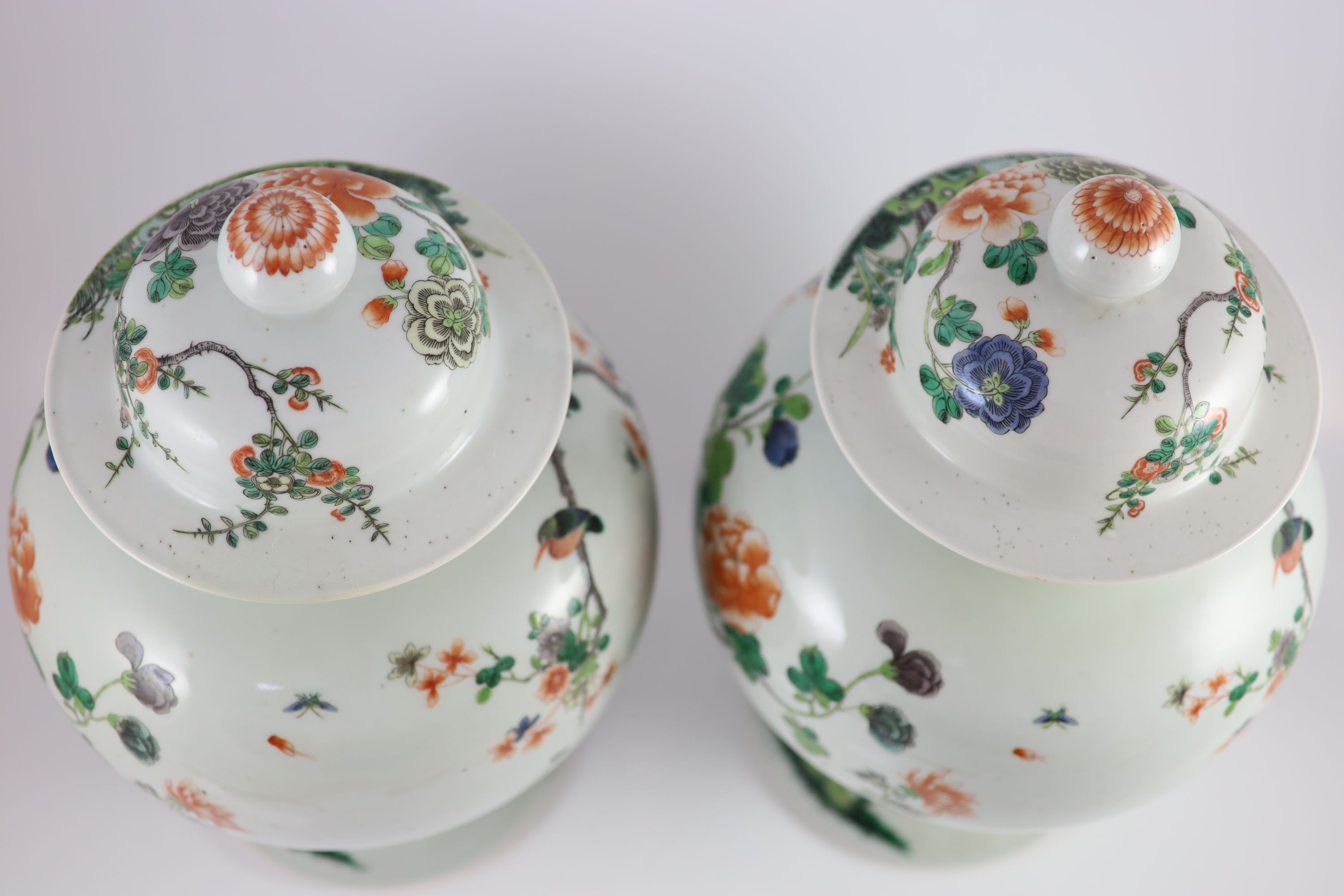 A pair of large Chinese famille verte jars and covers, late 19th century, 45cm high, restoration